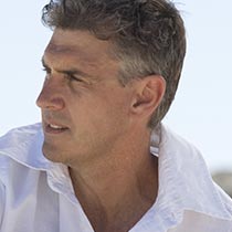 After his neck lift, a man enjoys a sunny day outdoors.